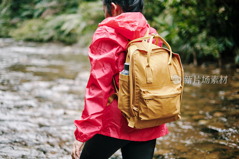 Close up - Women Wearing Windbreaker and Backpack